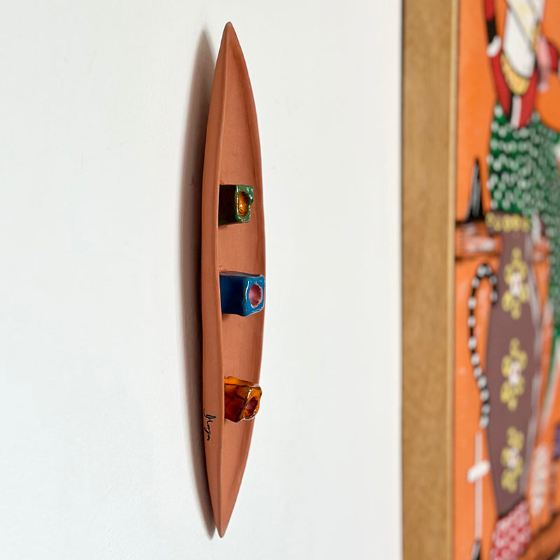 Escultura canoa em cerâmica